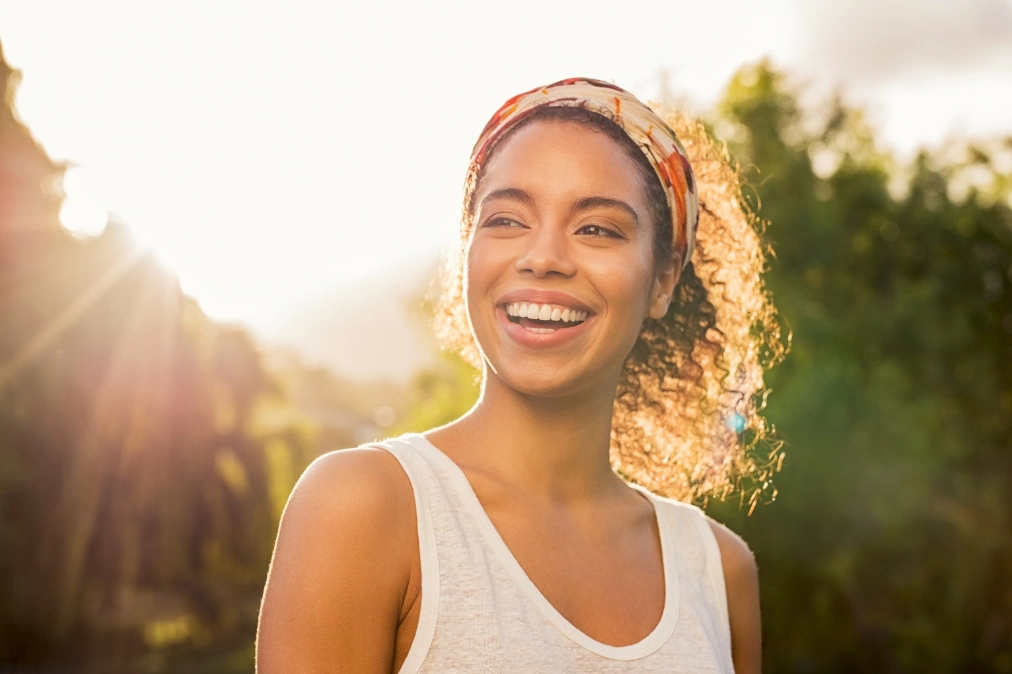 woman smiling in the sunlight